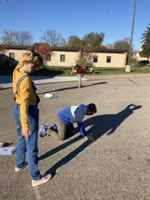 Students outdoors doing a science investigation